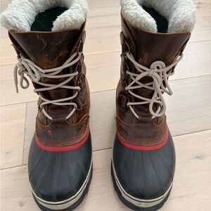 Sorel Men's Rugged Brown and Black Boots with Red Trim